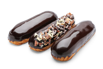 Delicious eclairs in chocolate glaze on white background