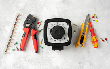 Laboratory autotransformer and hand tools on the construction table. Electrical tools on a light...