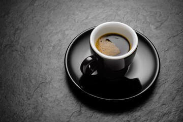 Espresso coffee in small porcelain mug.