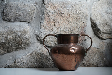 copper vase in rustic house