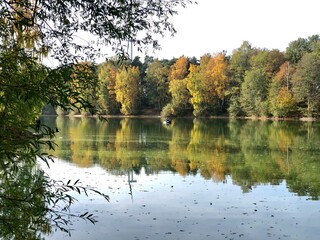 Fototapeta na wymiar autumn landscape with trees and lake, lengerich, germany
