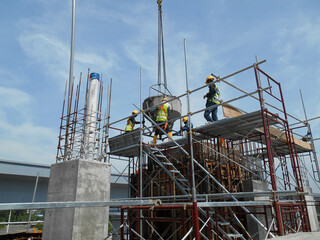 Fototapeta premium SEPANG, MALAYSIA APRIL 08, 2015: Bar bending yard at the construction site. Construction workers bend the reinforcement bar to follow the design. 