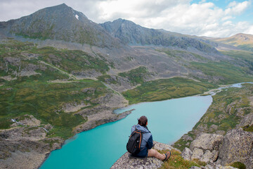 Fototapeta premium tourist near a mountain lake