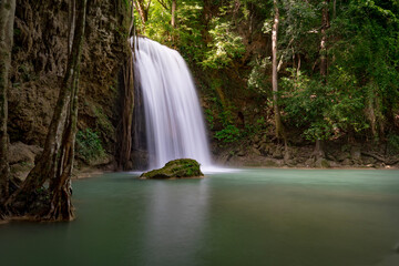 Fototapeta na wymiar Beautiful waterfall in the forest at Erawan waterfall National Park, Thailand