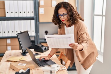 Middle age hispanic woman working at ecommerce