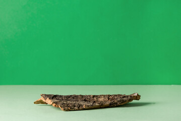 Natural Stand of Bark Tree for Presentation and Exhibitions on Green Background Abstract Podium for Organic Cosmetic Products Minimal Style