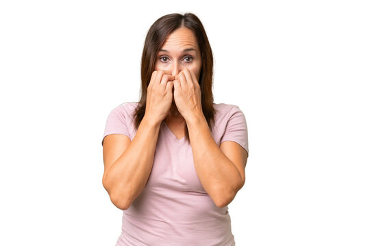 Middle-aged caucasian woman over isolated background nervous and scared putting hands to mouth