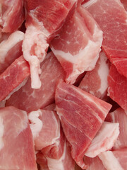 Raw chopped pork meat. Top view. Flat lay. Fresh raw diced red pork meat