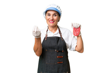 Butcher woman wearing an apron and serving fresh cut meat over isolated background making money gesture