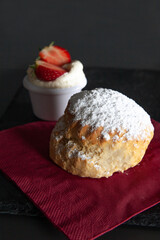 scone with cream and strawberries