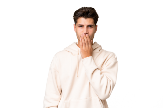 Young caucasian handsome man over isolated background covering mouth with hand
