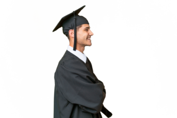 Young university graduate caucasian man over isolated background in lateral position