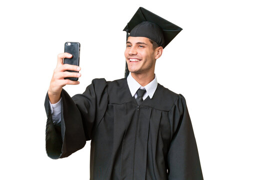 Young university graduate caucasian man over isolated background making a selfie