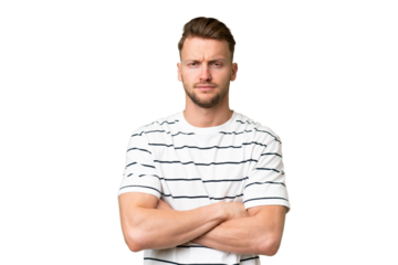 Young blonde caucasian man over isolated background feeling upset