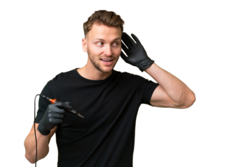 Tattoo artist caucasian man over isolated background listening to something by putting hand on the ear