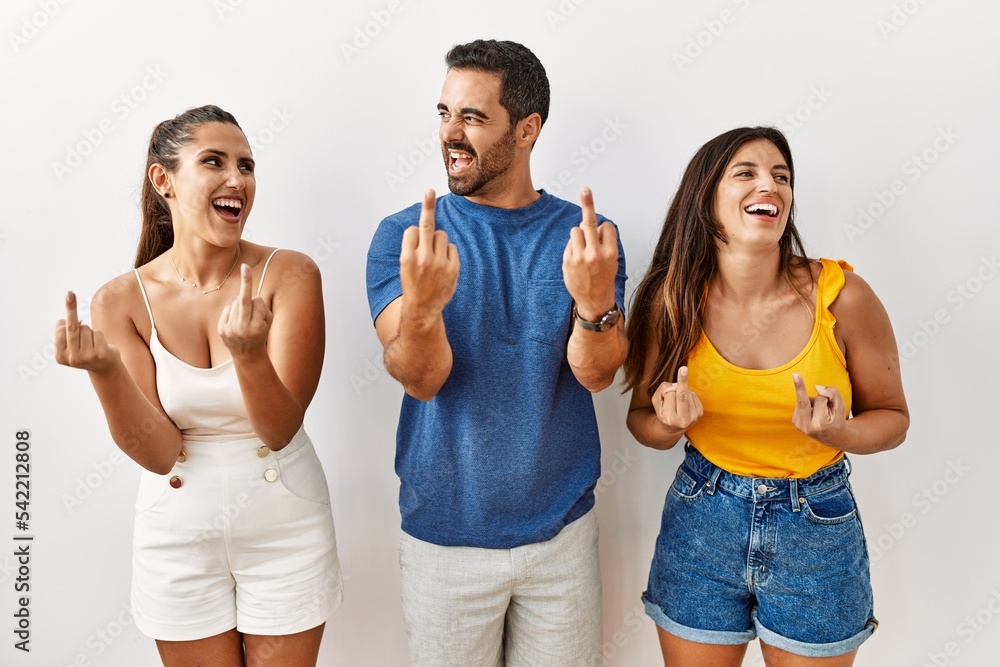 Sticker group of young hispanic people standing over isolated background showing middle finger doing fuck yo