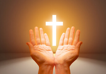 Christian crucifix. Praying hands. Catholic cross glows. Christian cross and praying hands. Hands...
