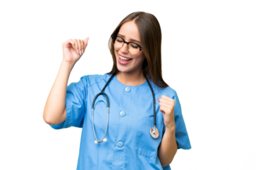 Young nurse caucasian woman over isolated background celebrating a victory