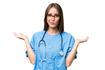 Young nurse caucasian woman over isolated background having doubts while raising hands