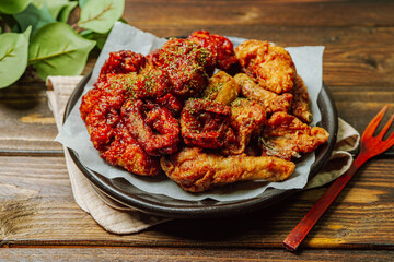 yangnyeom chicken, Korean Seasoned Fried Chicken : This dish is seasoned chicken cut into pieces, deep- fried, and mixed with soy sauce, gochujang, or other sauces. It has a mild yet spicy taste that 