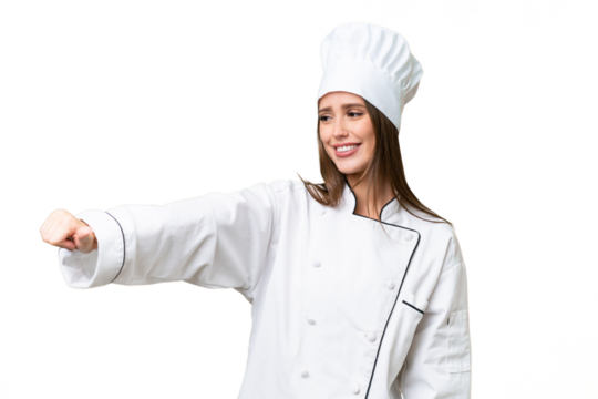 Young chef caucasian woman over isolated background giving a thumbs up gesture