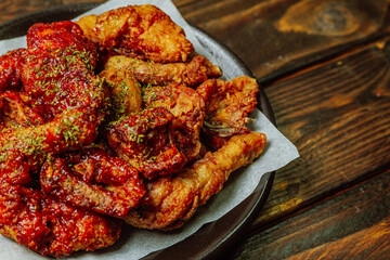 yangnyeom chicken, Korean Seasoned Fried Chicken : This dish is seasoned chicken cut into pieces, deep- fried, and mixed with soy sauce, gochujang, or other sauces. It has a mild yet spicy taste that 