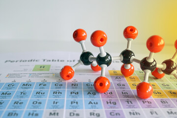 Simulate Shape of covalent molecules on a periodic table background. Soft and selective focus.     ...