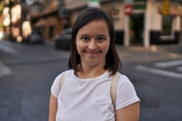 Down syndrome woman smiling confident standing at street