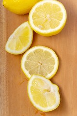 Fototapeta na wymiar Lemon slices on cutting board. Top view. Close up.