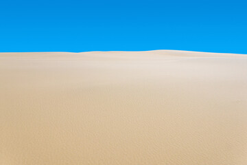 desert landscape, sand dunes under blue sky