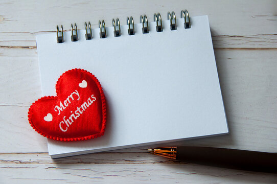 Merry Christmas text on heart shape with customizable space for text. Copy space.