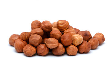 Beautiful toasted hazelnuts isolated on a white background