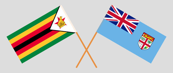 Crossed flags of Zimbabwe and Fiji. Official colors. Correct proportion