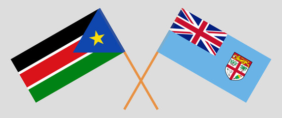 Crossed flags of South Sudan and Fiji. Official colors. Correct proportion