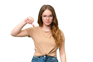 Young pretty woman over isolated background showing thumb down with negative expression