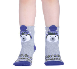 Children's legs in socks on white background isolation