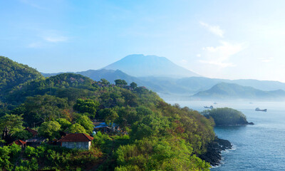 Aerial Of Amazing Agung Volcano Over Lush Green Tropical Forest With Ships And Ocean, Bali, Indonesia