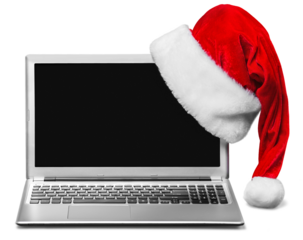 Laptop  and Santa Claus hat isolated on white background
