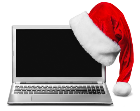 Laptop  and Santa Claus hat isolated on white background