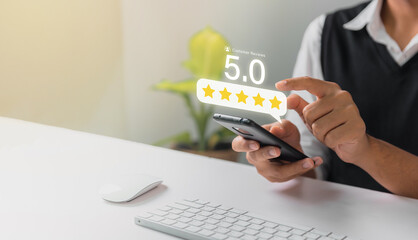 Businessman give 5 ster rating on virtual touch screen to service experience. Customer service and Satisfaction concept © Idol Design