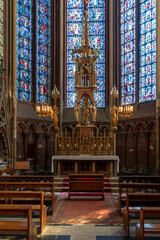 Fototapeta na wymiar ornate golden altar in one of the side chapels of the historic Amiens Cathedral