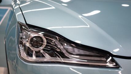 Obraz na płótnie Canvas LED headlight lamp part of the modern design car. Close-up and selective focus.