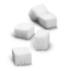 Cubes of sugar on white background
