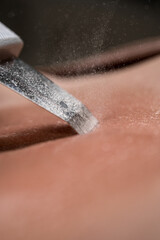 Fototapeta premium Ultrasonic combined cleaning of the face and decollete
