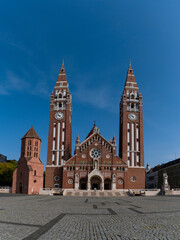 Fototapeta na wymiar view of the twin-spire Roman Catholic Votive Church in Szeged