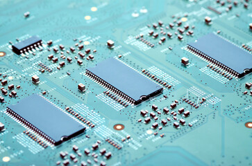 high-tech electronic board with microprocessors and electronic parts close-up, soft focus