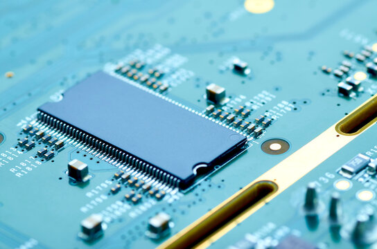 microchip and electronic components on the board close-up, soft focus