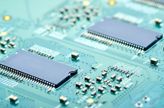 high-tech microprocessors and electronic components on the board close-up, soft focus