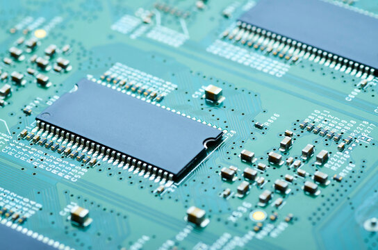 microchips and electronic components on the board close-up, soft focus
