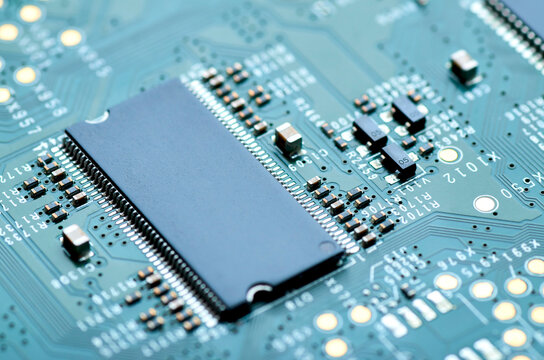 electronic micro components and microchip on the motherboard close-up, soft focus